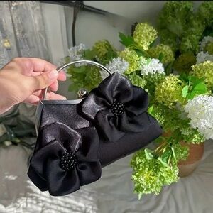 Elegant Black Handbag with Floral Accents